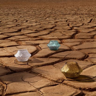 Pots placed on a cracked earth surface