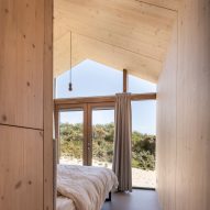 Master bedroom with wood panelling and large window