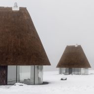 YOD Group crowns glass-sided huts with 10-metre-tall thatched roofs