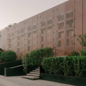 TIMM Architecture fronts House of Iron Doors with weathered steel shutters
