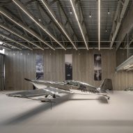Pluskouple designs monochrome aircraft hangar for Ukraine skydiving collective