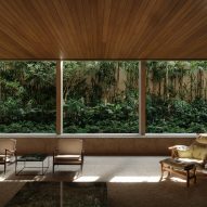 Concrete grid creates "sequence of framed views" at Rua Pol&ocirc;nia House in Brazil