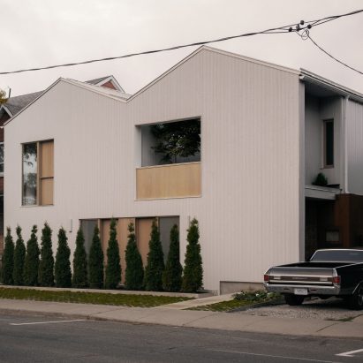Pale cedar cladded duplex in Canada